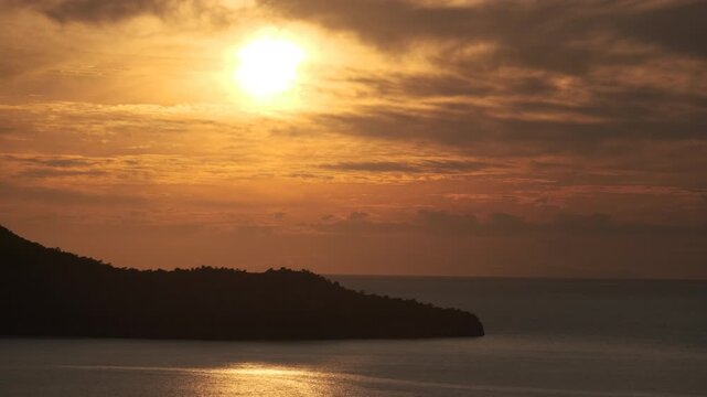 Aerial view of a tranquil sunset over the sea with silhouetted islands in Fethiye, Turkey, ab01