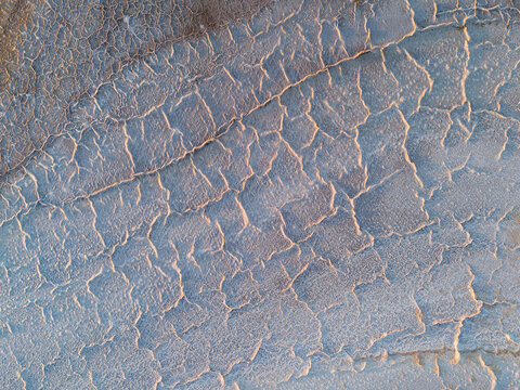 Aerial view of cracked earth revealing stark patterns etched by time and weather, a desolate beauty in Lake Campion Nature Reserve, Lake Campion, Western Australia, Australia.