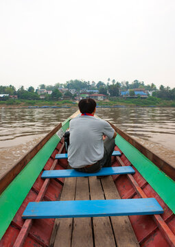 Man in a  speedboat on mekong river, Houei xay, Laos