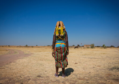 Rear view of a Mumuhuila tribe woman, Huila Province, Chibia, Angola
