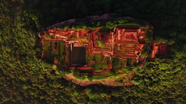 Cinematic aerial top-down of Sigiriya Lion Rock &ndash; Ancient fortress ruins and lush tropical jungle in the cultural triangle of Sri Lanka