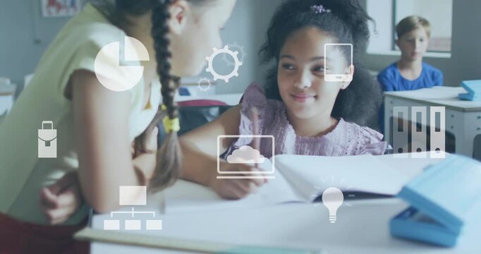 Left girl leaning in, pointing at book; peer writing, helping with school, icons floating over desk
