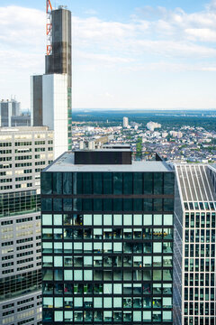 Clear daylight rooftop viewpoint on a Frankfurt Germany skyscraper captures the modern skyline with offices and highrise architecture across the city