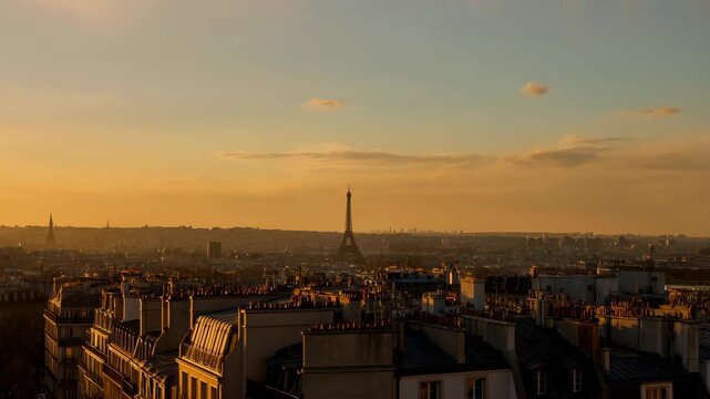 Paris skyline at sunrise with Eiffel Tower and cityscape in the morning light. featuring buildings, rooftops, architecture with urban and landscape