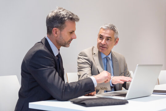 Two businessmen working together in office