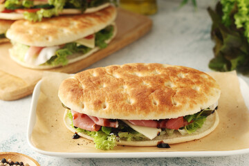 Panini sandwich with prosciutto in Italian style	