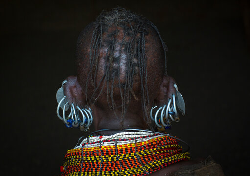 Turkana tribe woman with huge necklaces and earrings, Turkana lake, Loiyangalani, Kenya