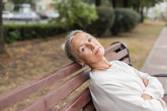 Portrait of senior woman relaxing on a bench