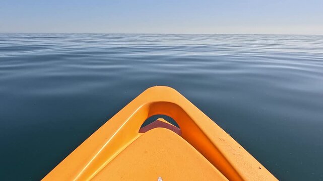 Kayak, ocean, calm, front of orange kayak gliding on tranquil blue water under clear sky, peaceful summer journey