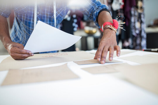 Close-up of fashion designer working on draft