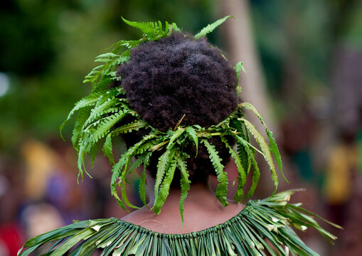 Woman with vegetal headwear, New Ireland Province, Langania, Papua New Guinea