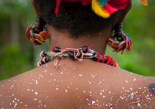 Tribal woman with poillen on her back, Milne Bay Province, Trobriand Island, Papua New Guinea