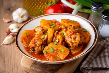 Fototapeta premium A chicken and potato dish from Turkish cuisine. Turkish name; Tavuk patates oturtma