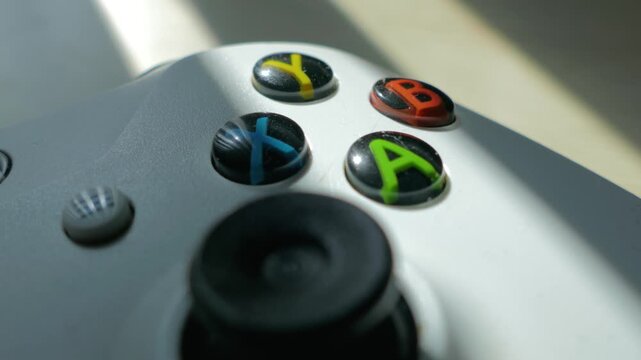 Macro White Video Game Controller Buttons in Sunlight