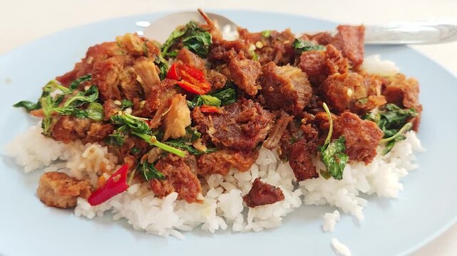 Pad Krapow Moo Krob with steam rice and crispy pork