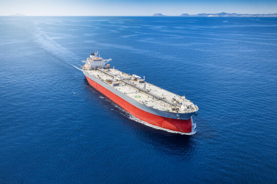 Aerial view of a large super tanker for crude oil traveling fast over the ocean