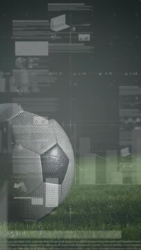 Vertical video: Soccer ball on left pitch, cleat contacting launching ball for sports HUD analytics
