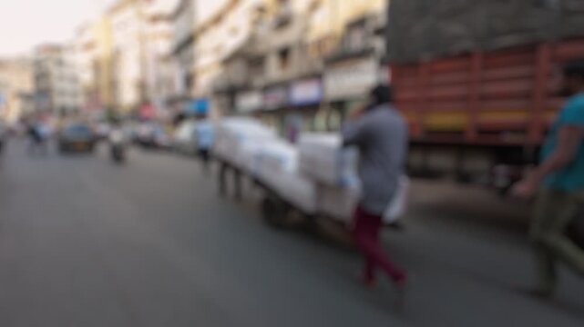 Bokeh view of crowded streets in Mumbai, India. Blurred background footage.
