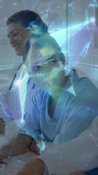 Vertical video: Nurse sitting listening to presenter tap, medical network lines forming over team