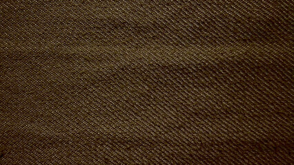 earthy brown twill denim fabric texture macro closeup reveals intricate diagonal weave pattern natural tactile folds