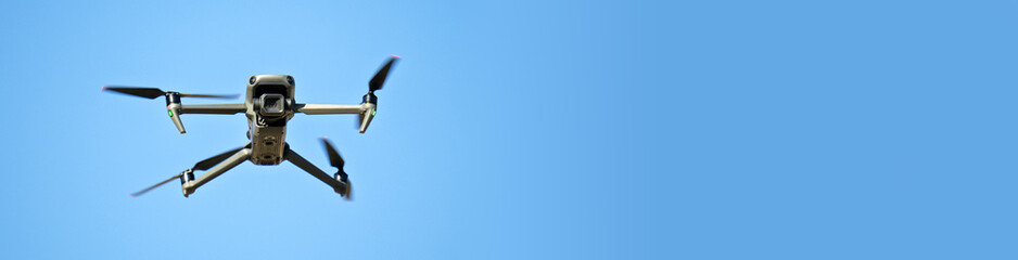 Banner with copy space. A drone is flying in the sky