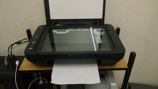 Open Flatbed Scanner Setup. Device Featuring Open Lid Revealing Scanning Surface And Components. Flatbed Scanning Device In Active Use With Cover Lifted Displaying Glass And Internal Parts