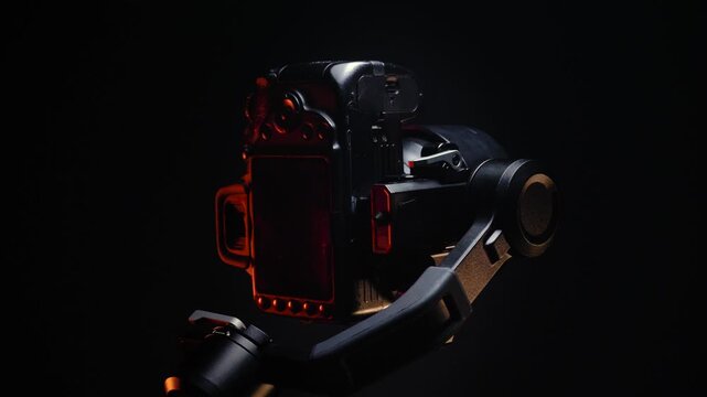 new electronic gyroscopic stabilizer for small SLR and mirrorless cameras and still cameras controlled via smartphone or joystick