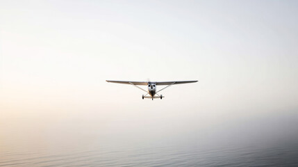 Vintage propeller aircraft flying over ocean horizon at dawn, journeying into the soft sky