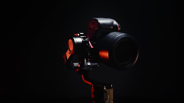 new electronic gyroscopic stabilizer for small SLR and mirrorless cameras and still cameras controlled via smartphone or joystick