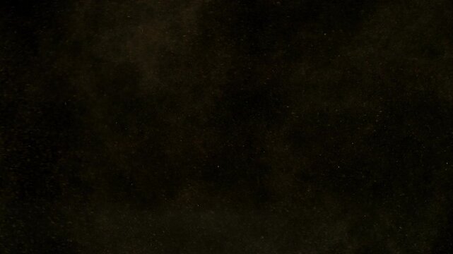 Super Slow Motion Shot of Flying Sand Powder , Isolated on Black Background , Filmed on High Speed Cinematic Camera at 1000 FPS