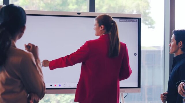 Businesswoman presentation digital whiteboard office teamwork discussion professional meeting collaboration technology corporate communication people modern workplace group strategy brainstorming