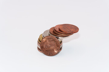 Close up of stacking coins on white background, USA one cent, Money growing concept, Save money with stack money coin for growing your business, copy space. The dime and the pennies