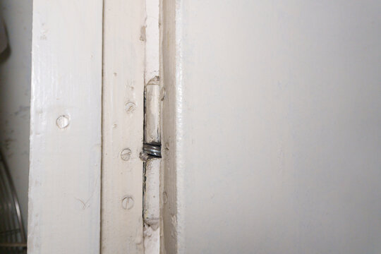 Old door hinges on a wooden door in an apartment, hinge repair. High quality