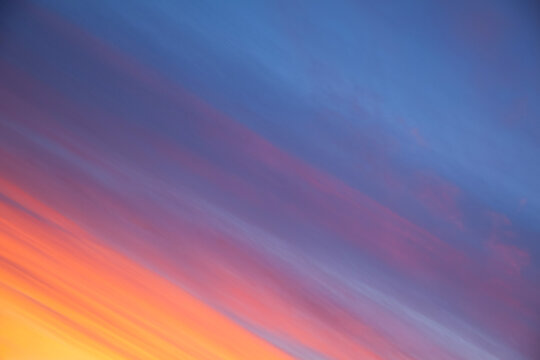 Beautiful orange and blue sunset sky diagonal view