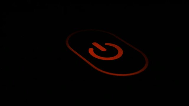 Glowing Orange Power Button Icon with Copy Space