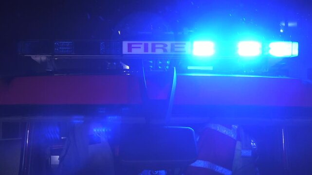 Flashing blue lights on a fire engine truck during an emergency. UK