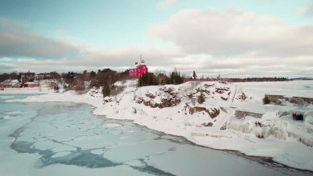 Marquette lighthouse in the wintertime drone shot
