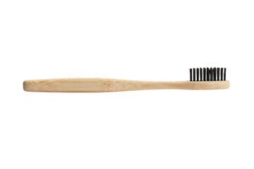 Naklejka premium Eco-friendly bamboo toothbrush with black charcoal bristles lying flat, sustainable oral care product isolated on transparent background cutout.