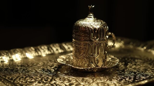 Traditional Ottoman style handcrafted copper coffee cup with intricate engraved floral patterns