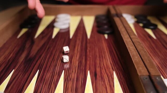 Slow Motion Close-up of Dice Rolling on a Backgammon Board, Chance and Strategy in Action