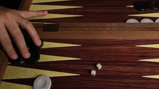 Close-up of Backgammon Player Making a Strategic Move with Rolling Double Fours (4-4)
