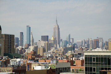 Fototapeta premium Views of New York City skyline with Empire State Building during daytime