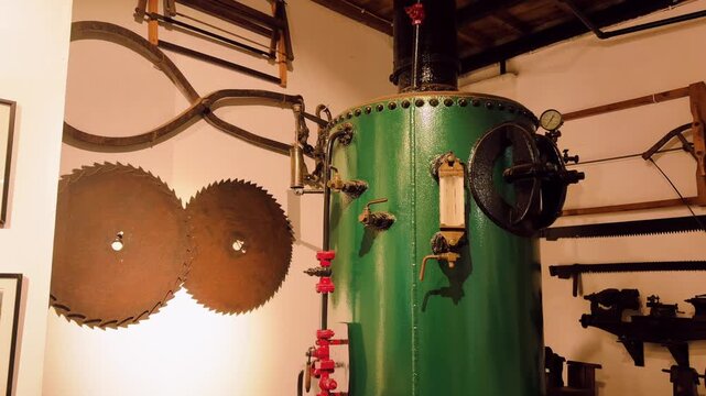Old steam boiler tank and machinery inside tea factory Azores
