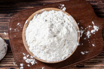 white flour or starch on wooden table