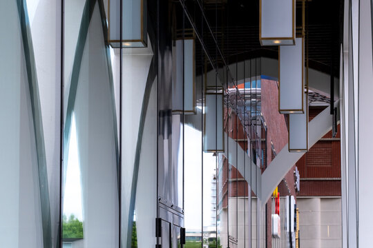 Modern architecture interior atrium with steel glass columns and beams showing symmetry in structure and design for contemporary public building space