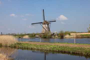 Naklejka premium One of the 19 windmills at Kinderdijk in the Netherlands. Built about 1740, this is the largest concentration of windmills in the Netherlands, a UNESCO world heritage site.
