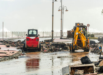 ruins and distructions cousea by a devastating typhoon on a sea coast. elimination of the damage and distructions caused by the hurricane to the coast © Yaroslav