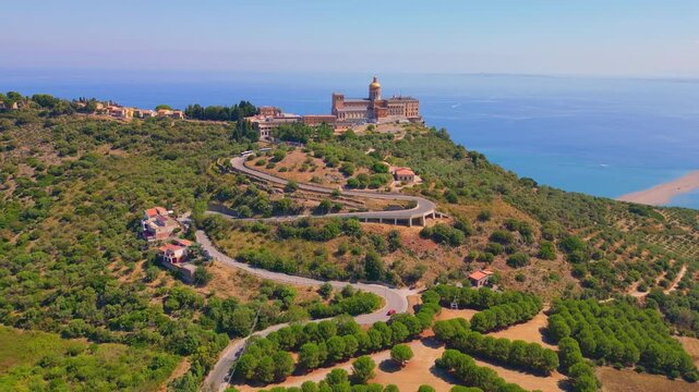 Aerial drone view of the Sanctuary of Tindari in Sicily, overlooking the stunning Mediterranean coast and lagoons. A breathtaking blend of history, faith, and Sicilian landscape from above.
