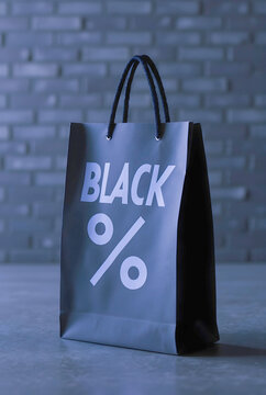A sleek, matte black shopping bag featuring bold white "BLACK %" typography stands prominently against a dark, industrial brick wall, capturing the minimalist essence of modern retail sales