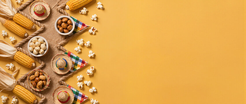 An overhead view of corn and nuts arranged on a table.